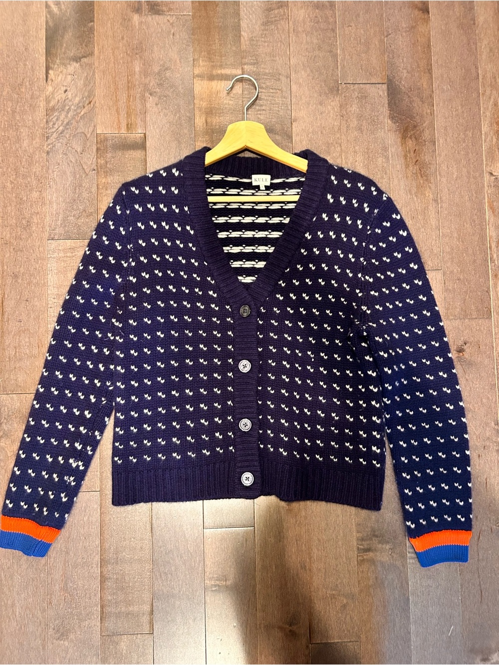 KULE Cashmere Navy Cardigan with White Dot Pattern and Orange & Blue Cuff Accent